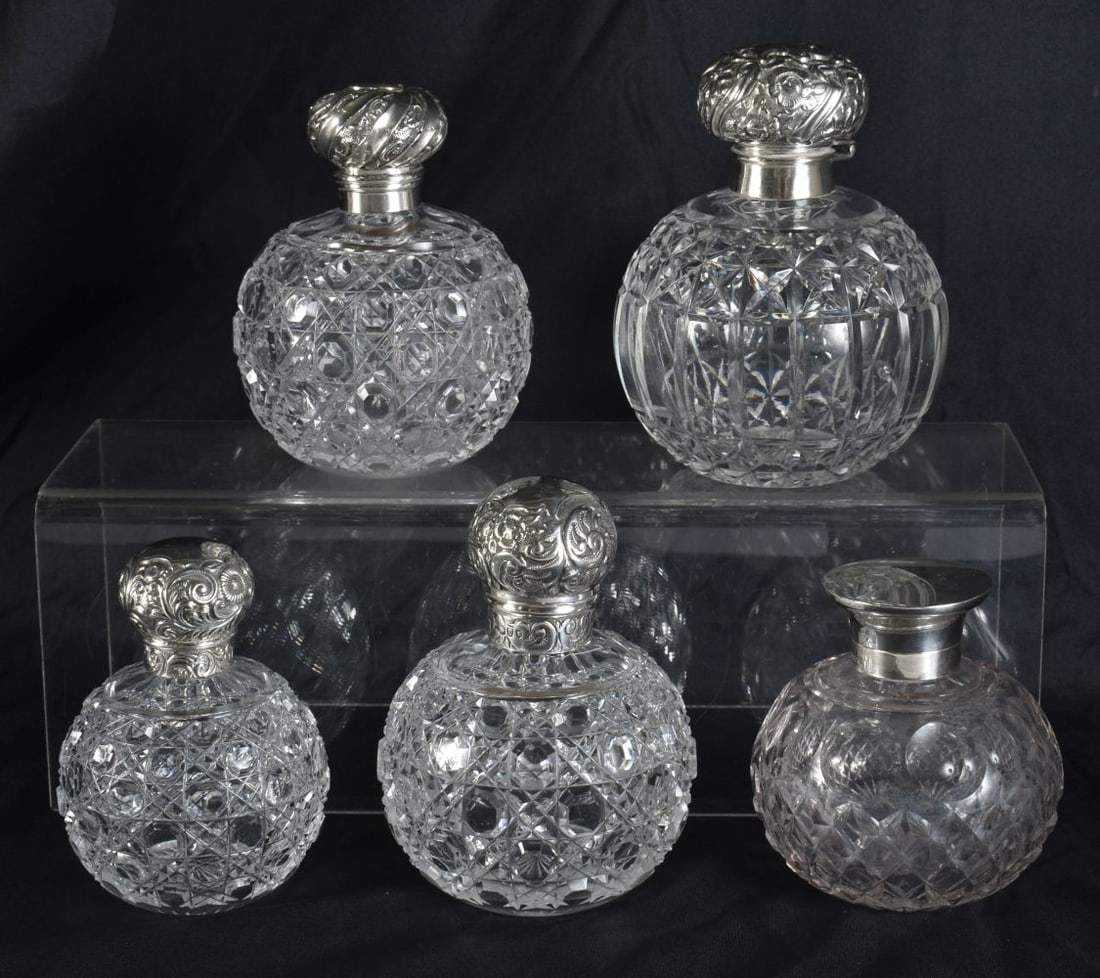 FIVE ANTIQUE SILVER MOUNTED SCENT BOTTLES. Largest 12 cm high. (5) (1 of 8)