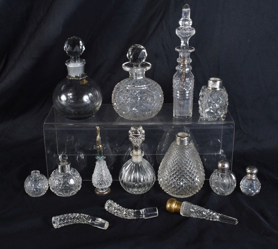ASSORTED CUT GLASS SCENT BOTTLES including two with silver mounts. (qty) (1 of 4)
