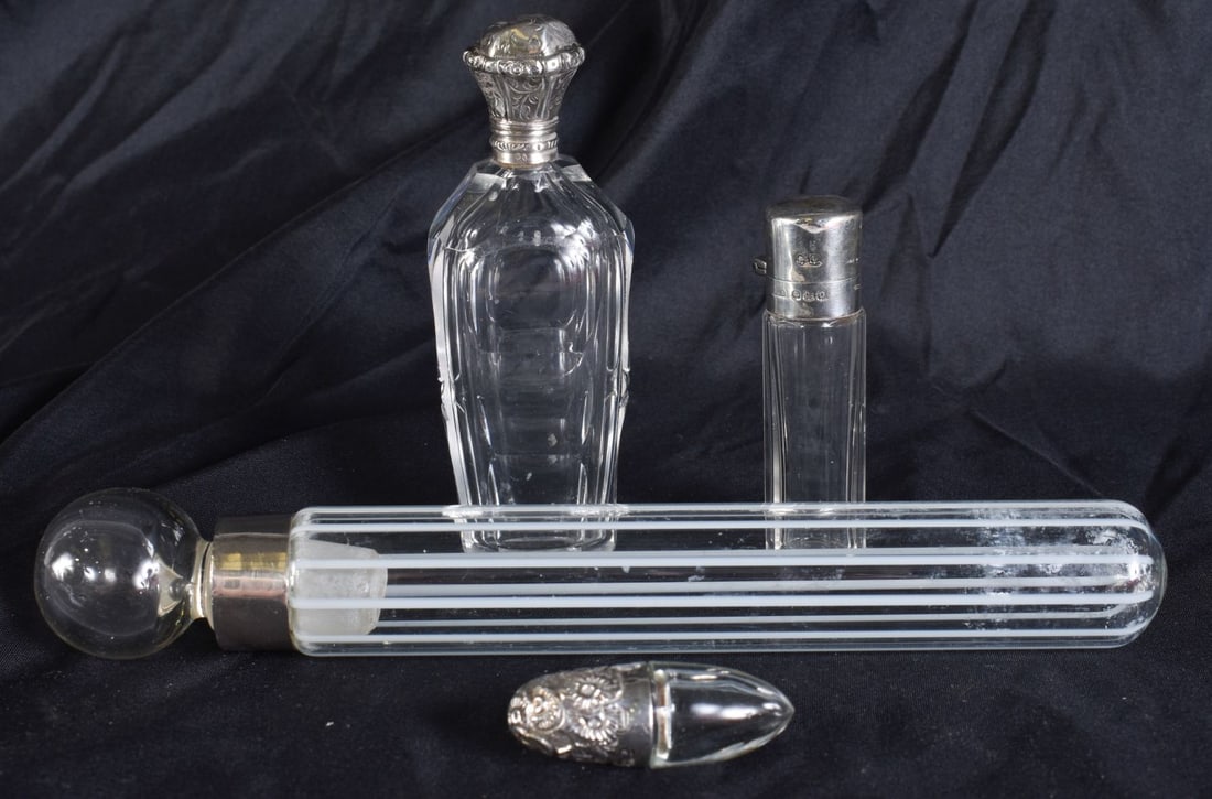 FOUR ANTIQUE SILVER MOUNTED SCENT BOTTLES. Largest 20 cm high. (4) (1 of 5)
