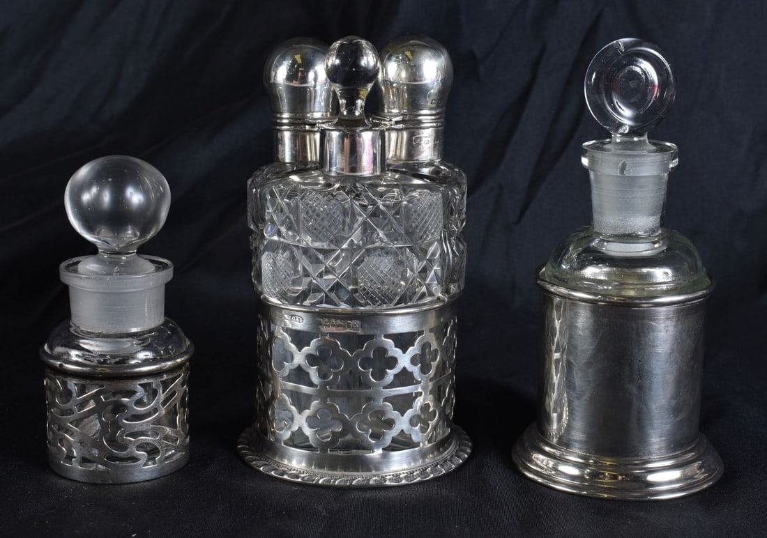 THREE ANTIQUE SILVER MOUNTED SCENT BOTTLES. Weighable silver 68 grams. (3) (1 of 4)