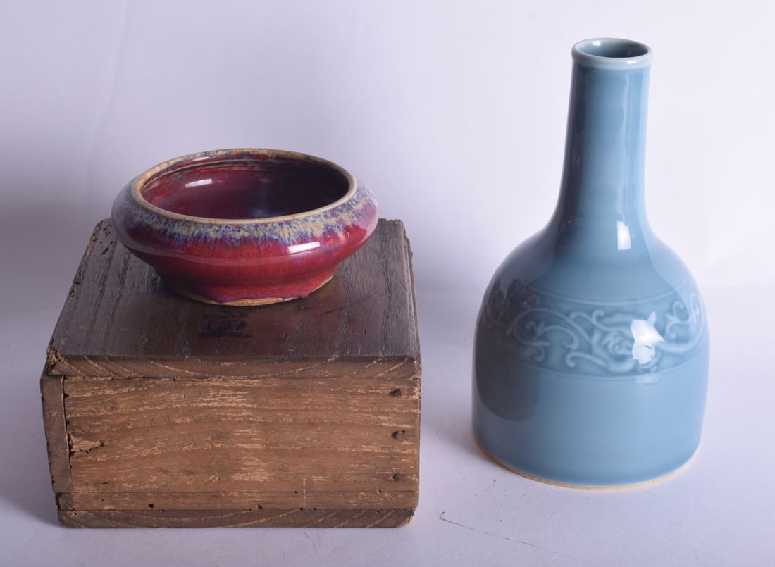 A CHINESE QING DYNASTY FLAMBE GLAZED PORCELAIN BRUSH WASHER together with a monochrome mallet vase. (1 of 3)