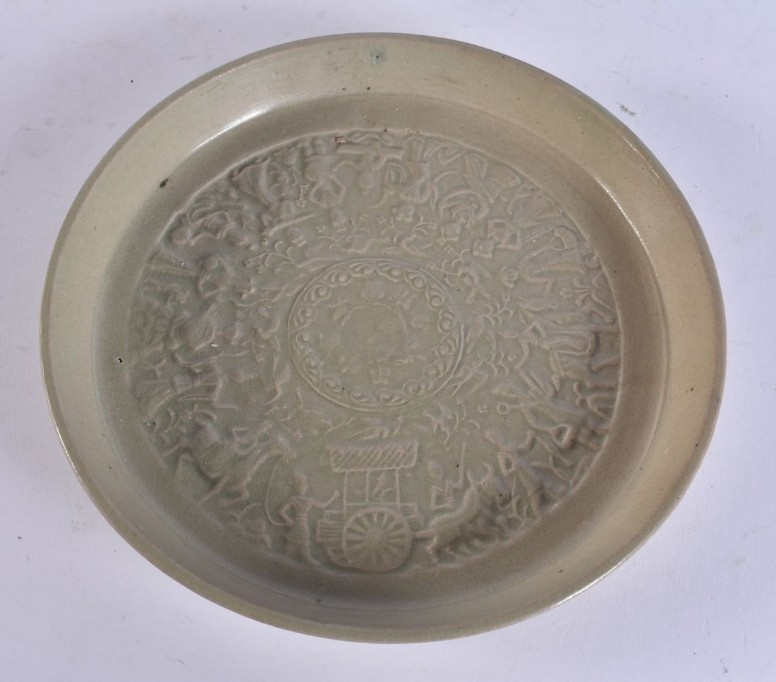 A 19TH CENTURY SOUTH EAST ASIAN CELADON GLAZED DISH decorated with immortals. 20.5 cm wide. (1 of 4)