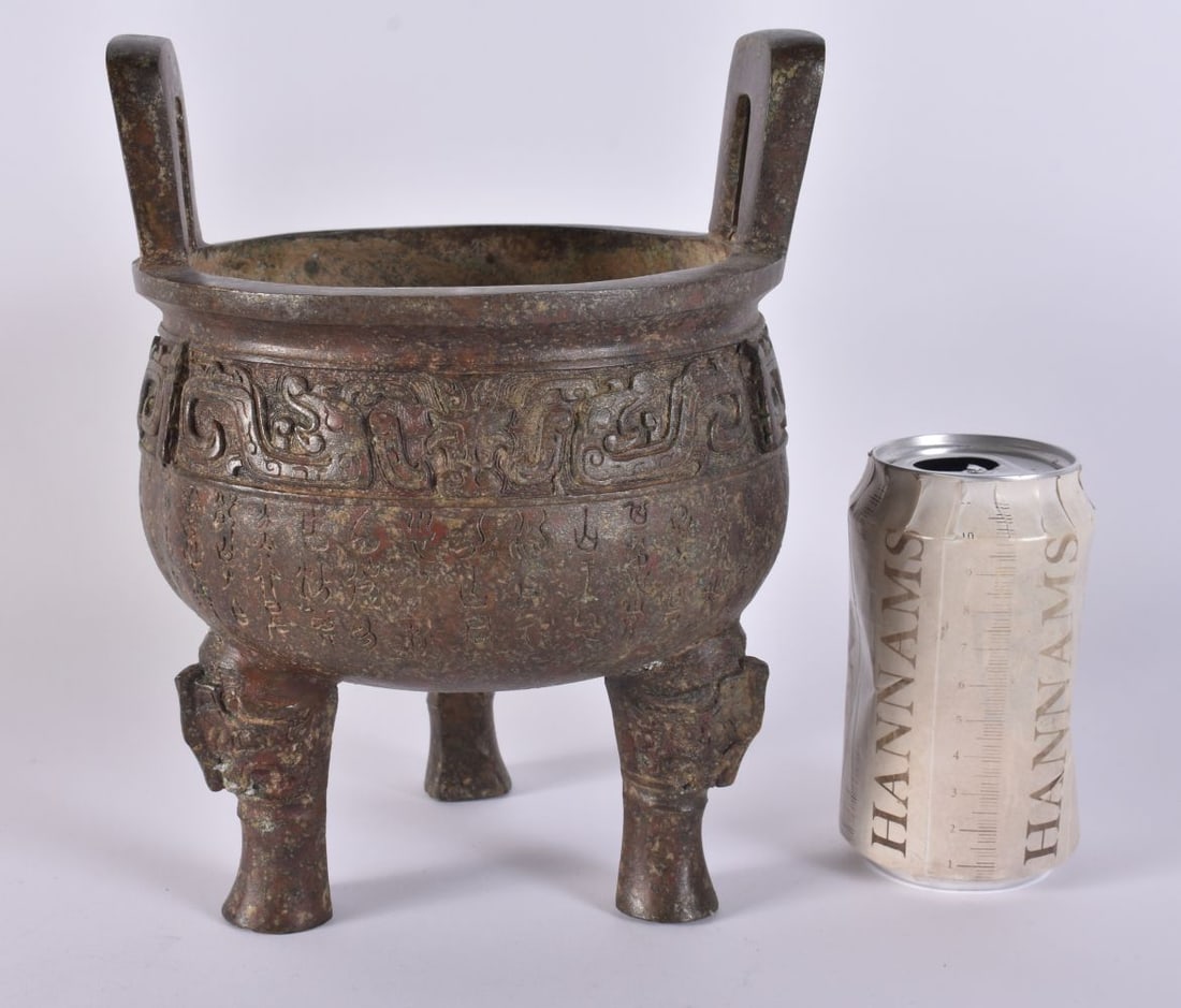 A CHINESE TWIN HANDLED ARCHAIC BRONZE CENSER. 23 cm x 14 cm. (1 of 5)