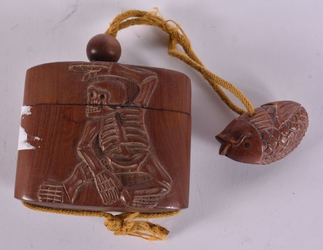 A JAPANESE WOOD SKELETON INRO. 6 cm x 6.5 cm. (1 of 3)