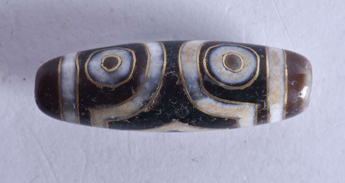 A Gold Inlaid Dzi Bead. 3.5cm long, weight 8.4g (1 of 3)