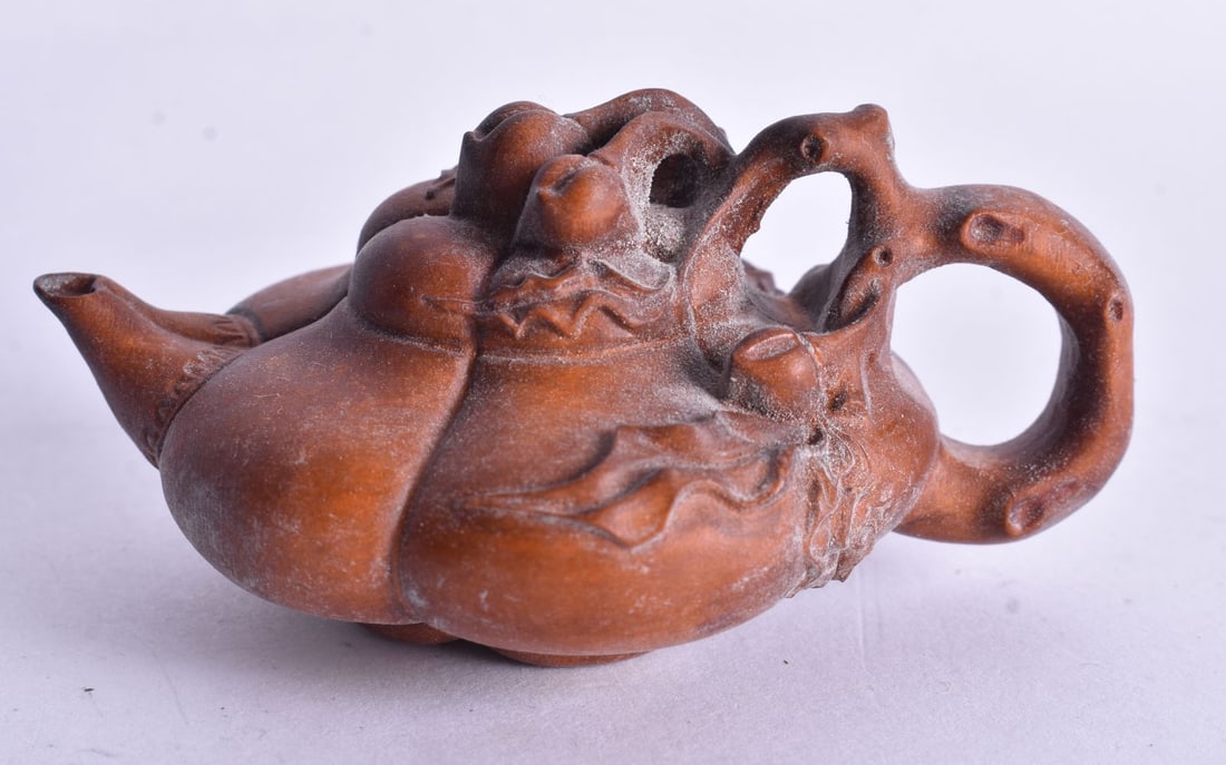 A Carved Chinese Teapot. 8cm x 5cm x 3cm (1 of 4)