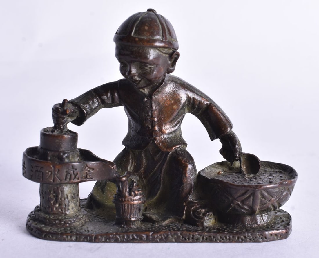 A Bronze Seated Boy Grinding Oil and Cooking. 7cm x 6cm x 3cm (1 of 4)