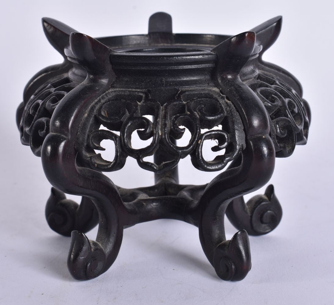 A 19TH CENTURY CHINESE CARVED WOOD RETICULATED STAND Late Qing. 11 cm wide, internal width 6.25 cm. (1 of 4)