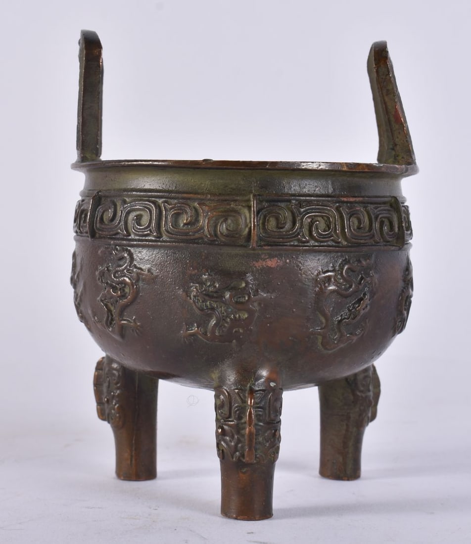 A CHINESE TWIN HANDLED BRONZE CENSER. 11 cm x 8 cm. (1 of 4)