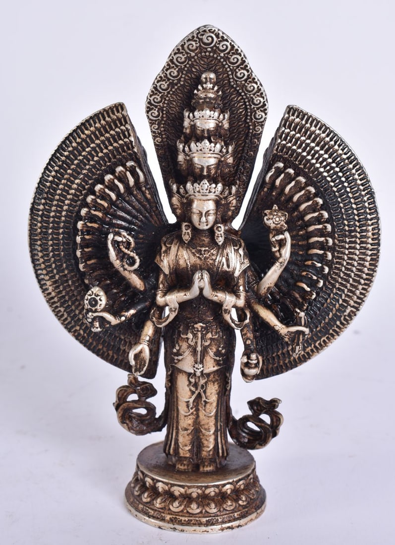 A CHINESE TIBETAN WHITE METAL DEITY. 9.5 cm high. (1 of 5)