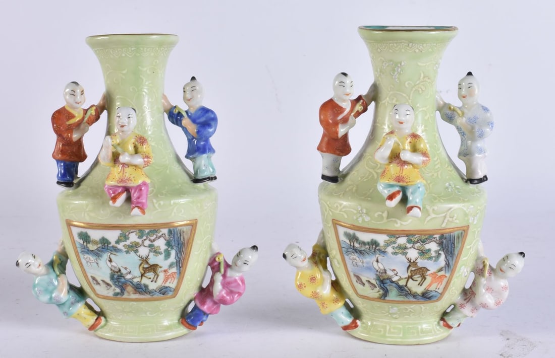 A PAIR OF CHINESE LIME GREEN PORCELAIN FIGURAL WALL VASES. 18.5 cm x 10 cm. (1 of 11)