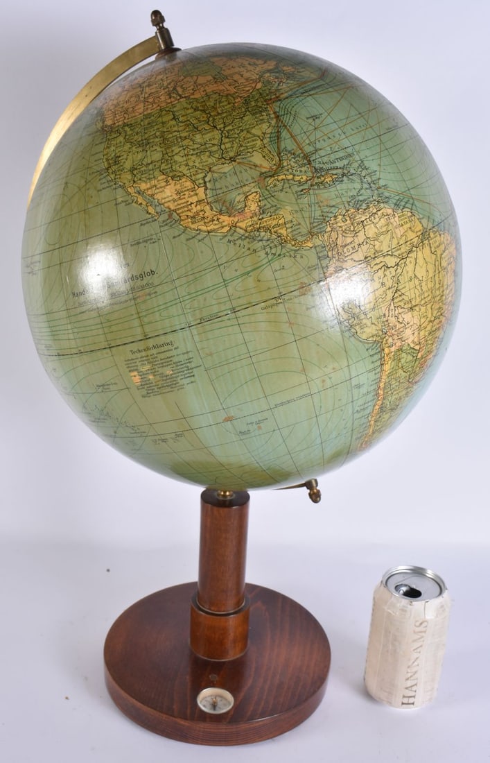 A LARGE TERRESTRIAL GLOBE inset with a compass. 52 cm x 22 cm. (1 of 6)