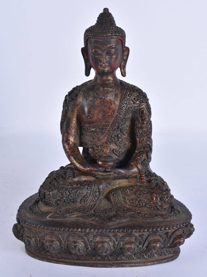 A TIBETAN BRONZE BUDDHA. 23 cm high. (1 of 6)