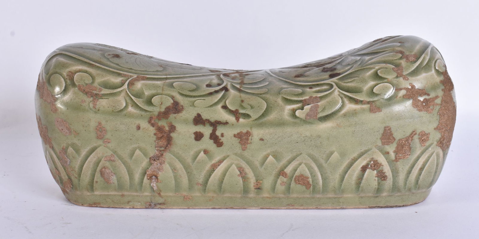 A CHINESE CELADON ENGRAVED PILLOW. 23 cm wide.: A CHINESE CELADON ENGRAVED PILLOW. 23 cm wide.