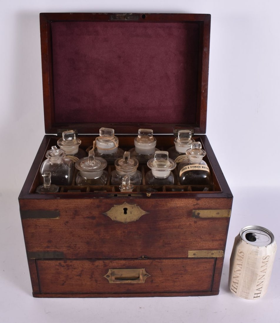 AN EARLY 19TH CENTURY MAHOGANY CASED APOTHECARY CABINET with glass bottles and fitted contents. 26 c (1 of 6)