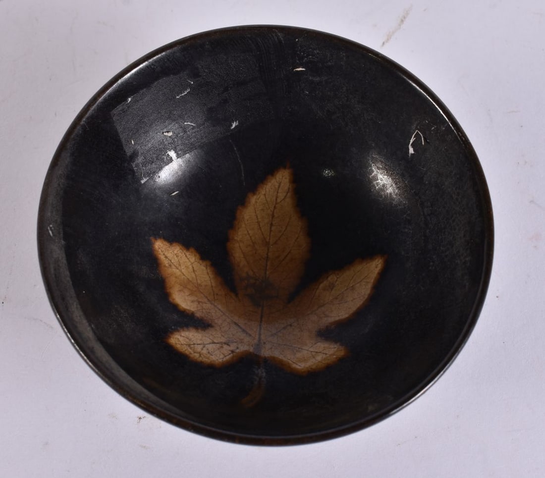 A CHINESE POTTERY LEAF BOWL. 10 cm wide. (1 of 3)
