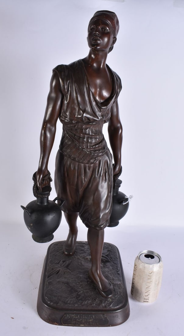 A LARGE ANTIQUE BRONZE FIGURE OF A WATER CARRIER. 65 cm high. (1 of 7)