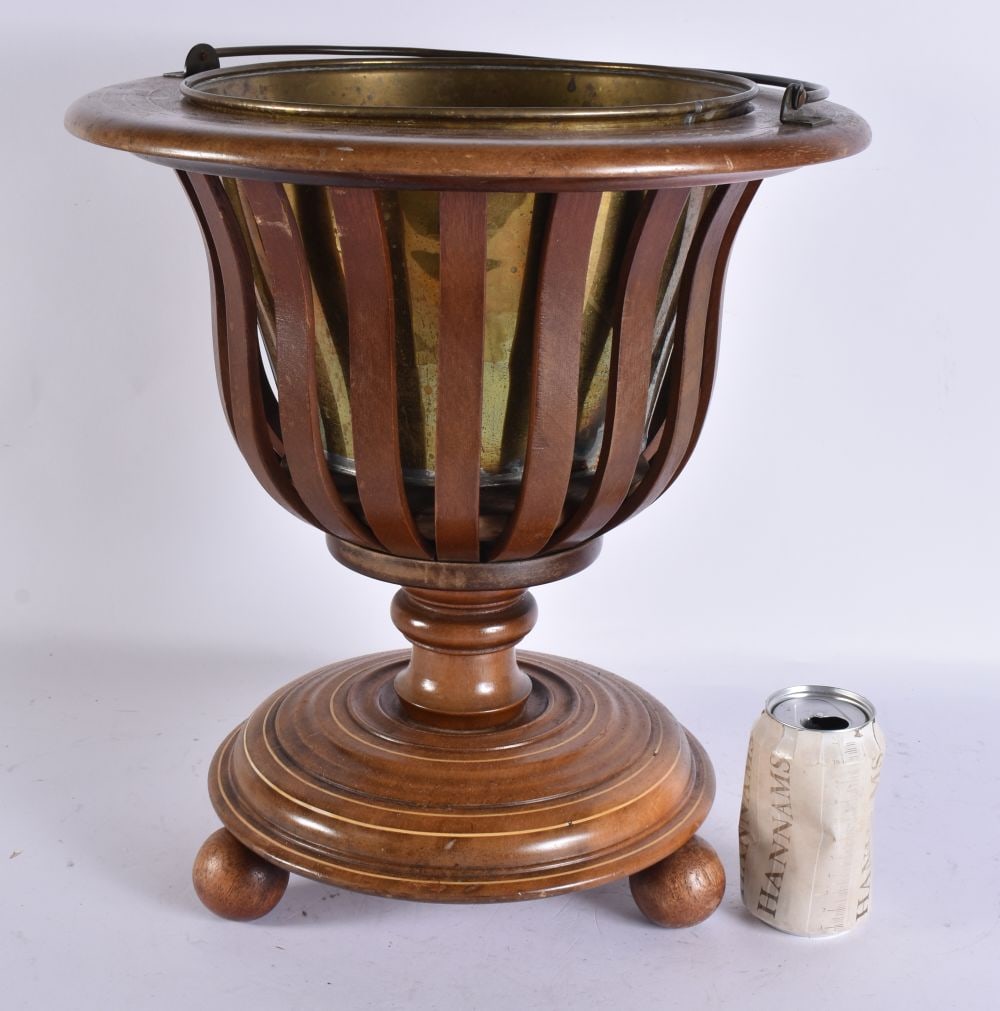 AN ANTIQUE WOOD BUCKET. 54 cm high inc handle.: AN ANTIQUE WOOD BUCKET. 54 cm high inc handle.