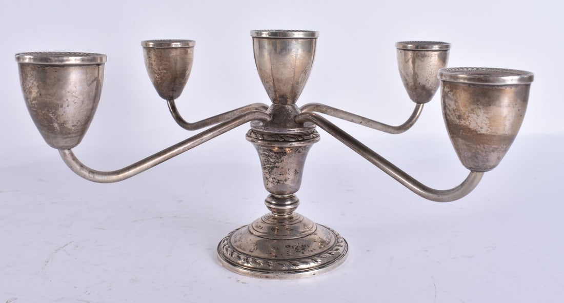 A SILVER CANDELABRA. 637 grams overall. 28 cm wide. (1 of 4)