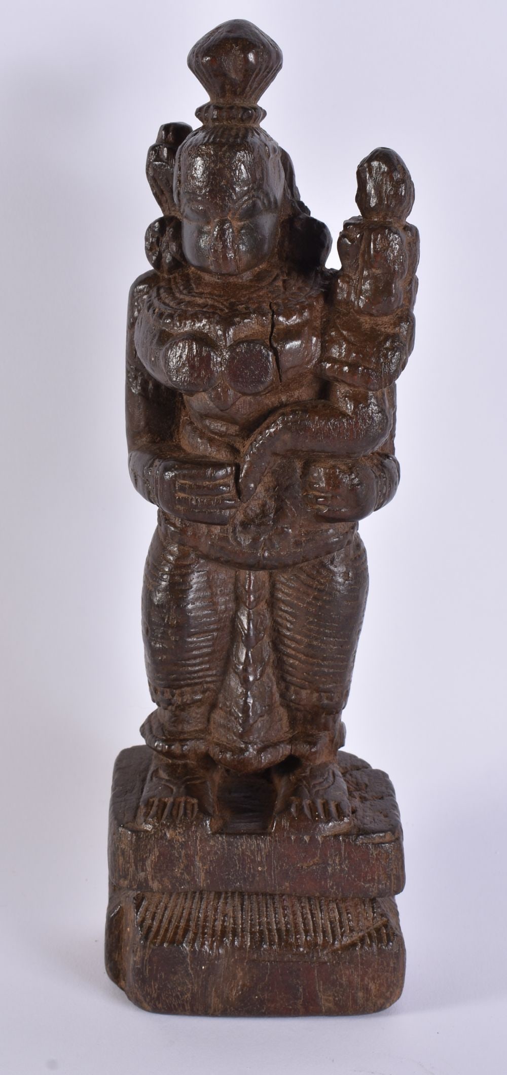 AN EARLY INDIAN CARVED WOOD DEITY modelled with an attendant. 27 cm high.: AN EARLY INDIAN CARVED WOOD DEITY modelled with an attendant. 27 cm high.