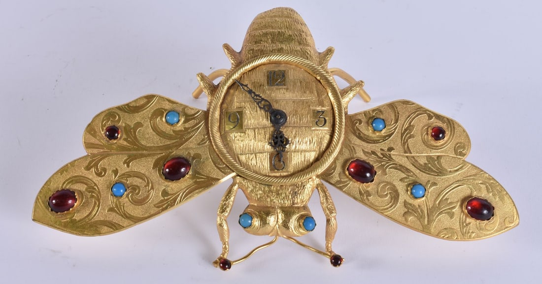 A RARE EARLY 20TH CENTURY GILT METAL GEM SET BUTTERFLY MOTH STRUT CLOCK. 22 cm wide.: A RARE EARLY 20TH CENTURY GILT METAL GEM SET BUTTERFLY MOTH STRUT CLOCK. 22 cm wide.