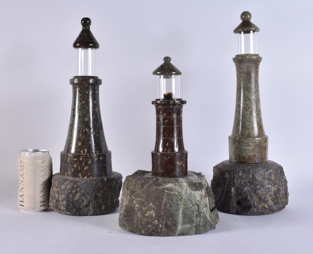 THREE CORNISH SERPENTINE LIGHTHOUSE LAMPS. Largest 38 cm high. (3): THREE CORNISH SERPENTINE LIGHTHOUSE LAMPS. Largest 38 cm high. (3)