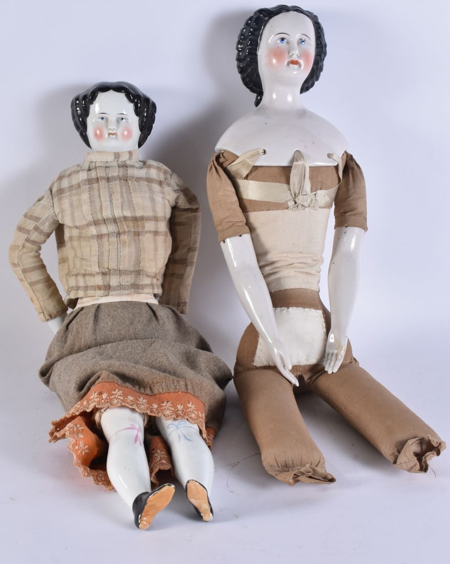 A RARE PAIR OF 19TH CENTURY PORCELAIN HEADED DOLLS of exceptionally large proportions. 57 cm long. (1 of 6)