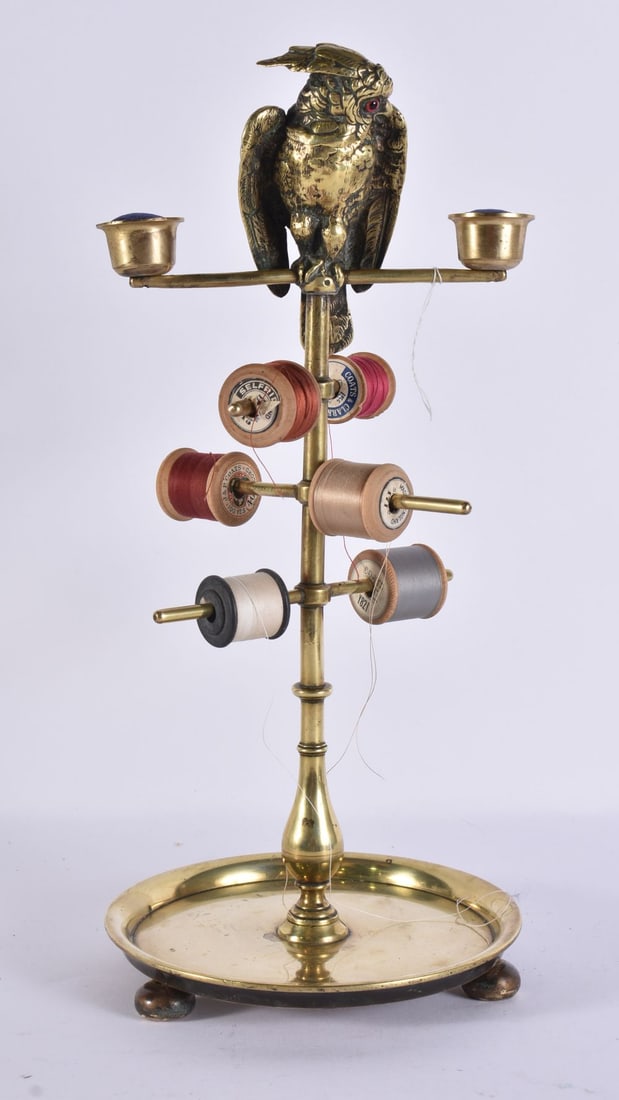 A CHARMING LATE VICTORIAN BRONZE DESK SEWING COMPENDIUM BIRD STAND modelled with a glass eyed parake (1 of 4)