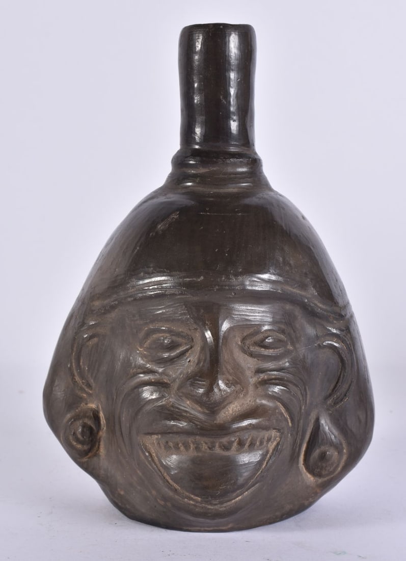 AN UNUSUAL SOUTH AMERICAN POTTERY TRIBAL VESSEL. 21 cm high.: AN UNUSUAL SOUTH AMERICAN POTTERY TRIBAL VESSEL. 21 cm high.