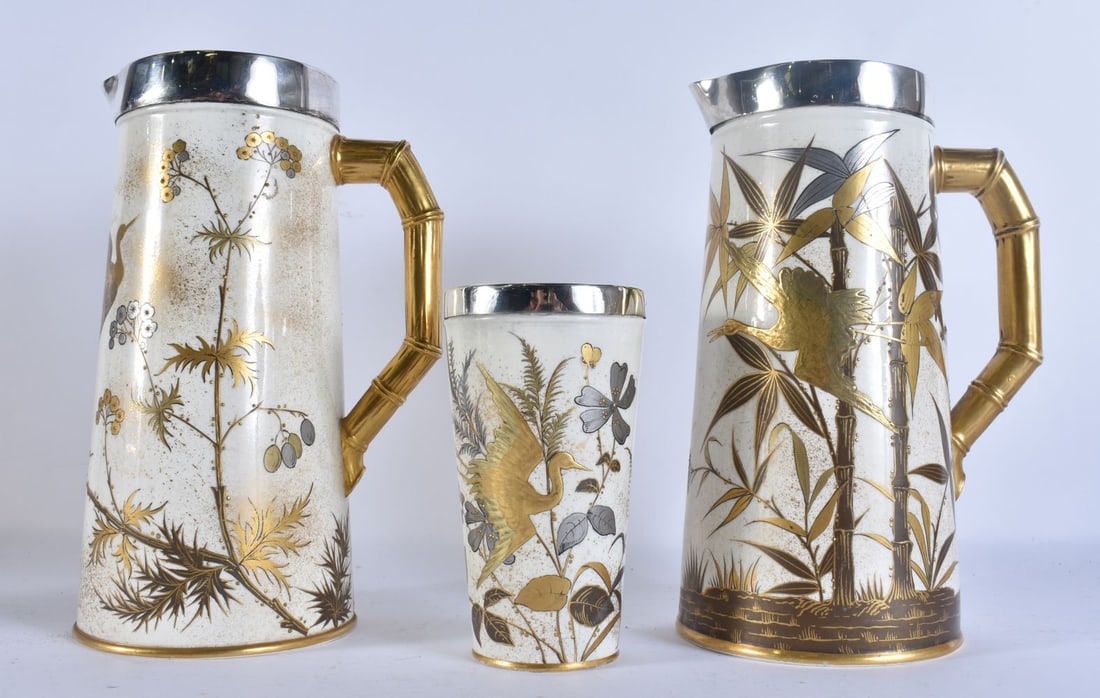 A NEAR PAIR OF AESTHETIC MOVEMENT ROYAL WORCESTER SILVER MOUNTED LEMONADE PITCHERS with a matching s (1 of 4)