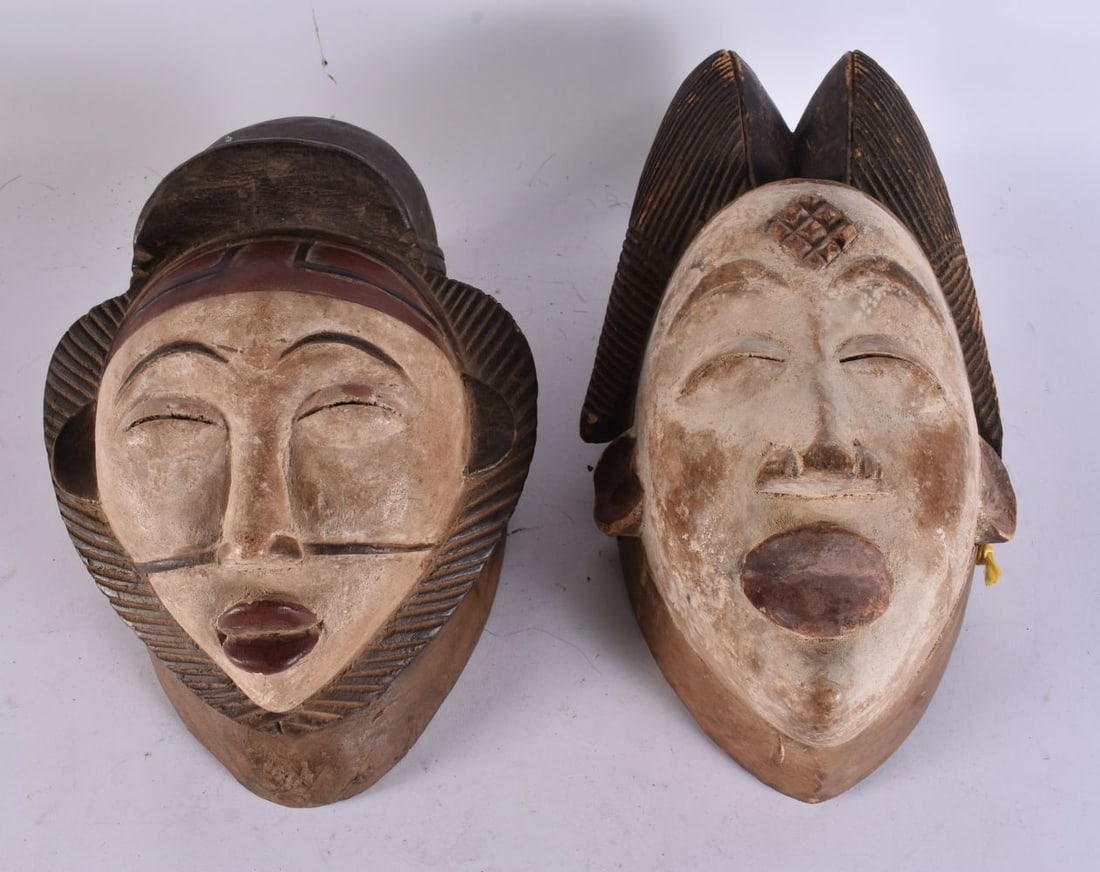 TWO AFRICAN PUNA GABON TRIBAL WOOD MASKS. 24 cm long. (2): TWO AFRICAN PUNA GABON TRIBAL WOOD MASKS. 24 cm long. (2)
