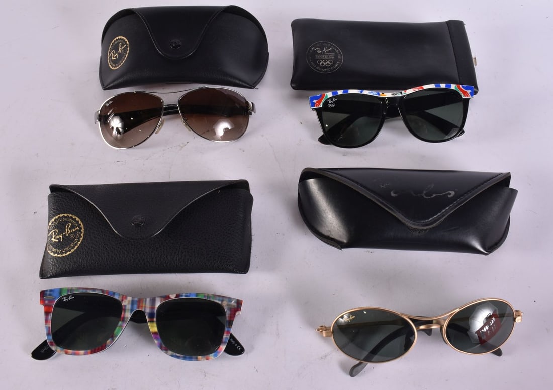 FOUR PAIRS OF RAYBAN SUNGLASSES including the Olympic variant. (4) We are UNABLE to offer in-House: FOUR PAIRS OF RAYBAN SUNGLASSES including the Olympic variant. (4) We are UNABLE to offer in-House shipping to USA or Canada on this Lot