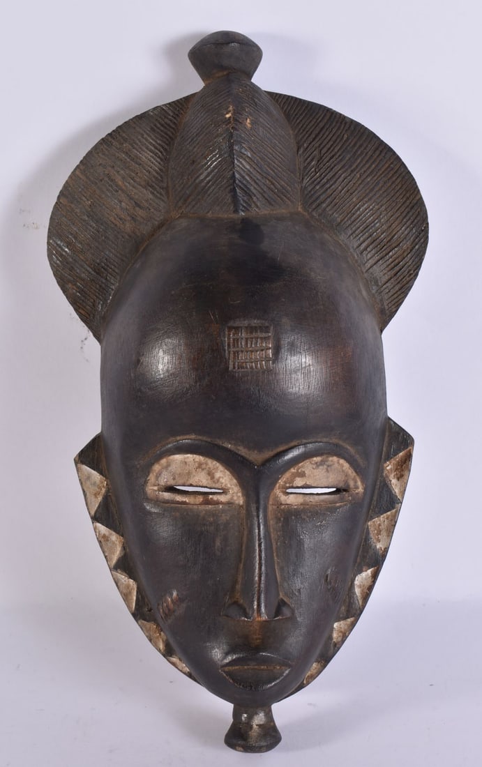AN AFRICAN TRIBAL WOOD MASK. 30 cm x 12 cm. (1 of 3)