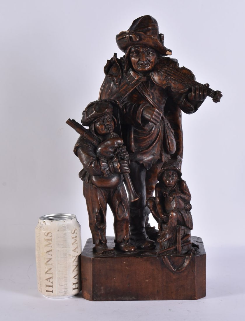 A LATE 19TH CENTURY BAVARIAN BLACK FOREST CARVED WOO FIGURE modelled as musicians with a monkey. 40 (1 of 6)