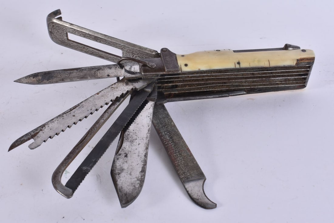 A LARGE 18TH/19TH CENTURY COACHMAN'S COMBINATION KNIFE with multiple functions. 32 cm long extended.: A LARGE 18TH/19TH CENTURY COACHMAN'S COMBINATION KNIFE with multiple functions. 32 cm long extended. We are UNABLE to offer in-House shipping on this Lot