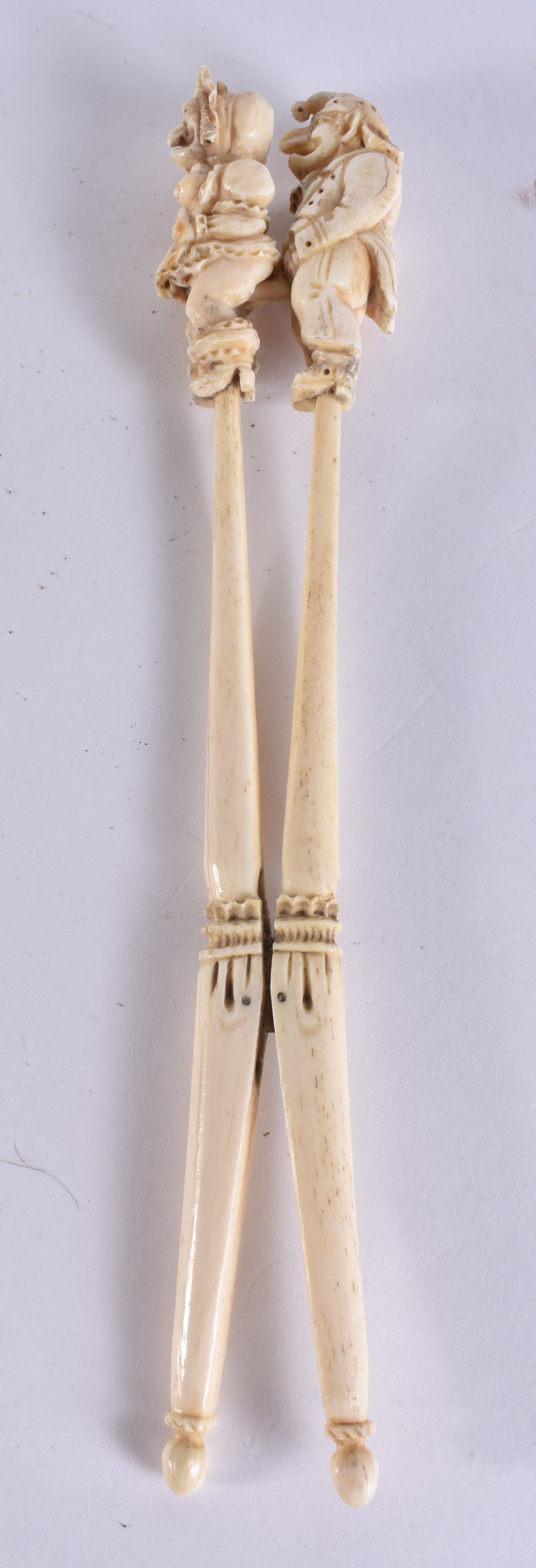 A RARE PAIR OF 19TH CENTURY FRENCH PRISONER OF WAR BONE GLOVE STRETCHERS formed as punch and judy. 2 (1 of 3)