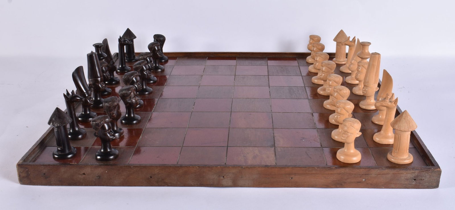 AN AFRICAN WOOD CHESS SET with board. Board 54 cm square. (qty) (1 of 8)