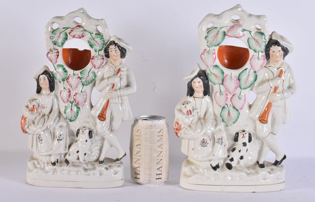 A PAIR OF VICTORIAN STAFFORDSHIRE POCKET WATCH HOLDERS. 30 cm x 18 cm. (1 of 6)