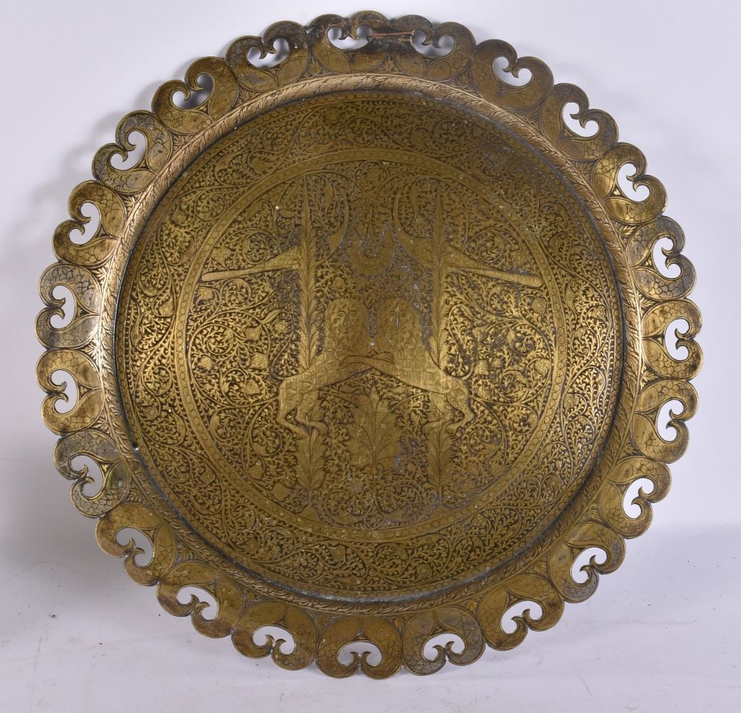 AN ANTIQUE INDIAN RETICULATED BRASS DOUBLE LION DISH. 29 cm wide. (1 of 4)
