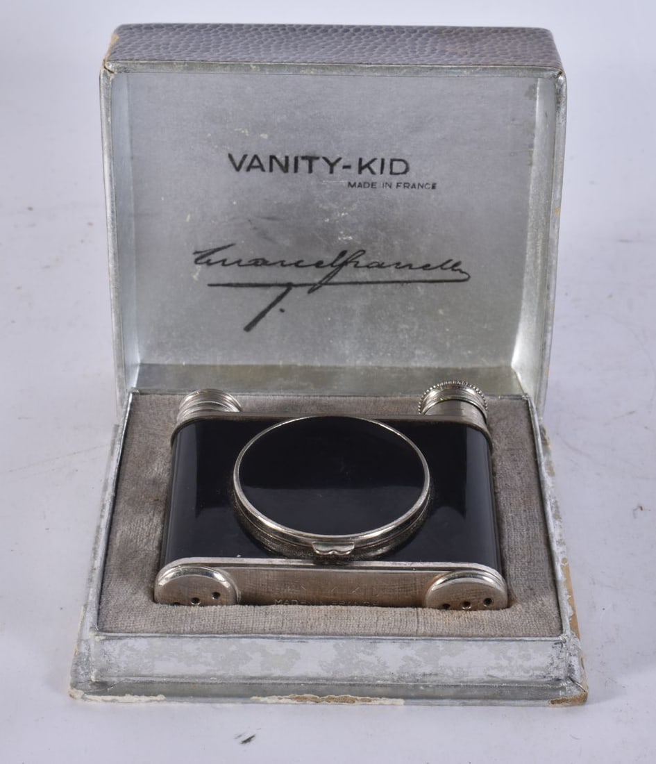 A 1920S FRENCH NICKEL AND ENAMEL VANITY-KID COMPACT BY MARCEL FRANCK in the original fitted box prin (1 of 4)
