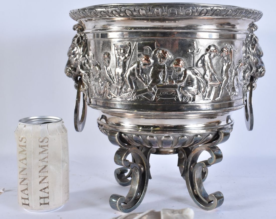 A MID 19TH CENTURY ENGLISH TWIN HANDLED MIXED METAL REPOUSSE PLANTER decorated with figures. 24 cm x: A MID 19TH CENTURY ENGLISH TWIN HANDLED MIXED METAL REPOUSSE PLANTER decorated with figures. 24 cm x 22 cm.