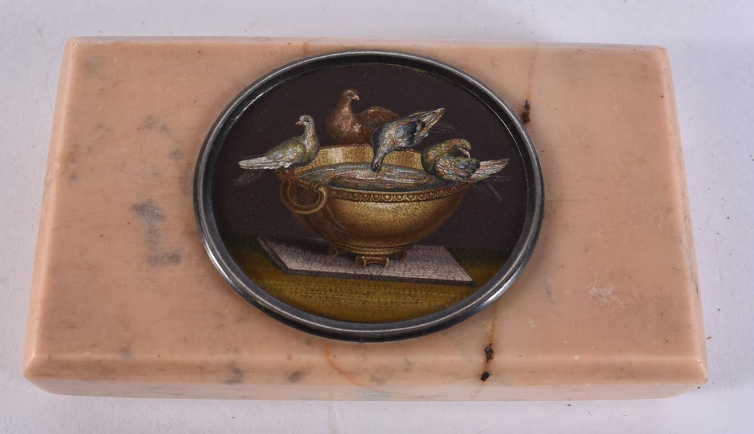 A 19TH CENTURY ITALIAN GRAND TOUR MICRO MOSAIC PLAQUE ON MARBLE depicting the Doves of Pliny with fo: A 19TH CENTURY ITALIAN GRAND TOUR MICRO MOSAIC PLAQUE ON MARBLE depicting the Doves of Pliny with four doves about a gilt basin, the circular micro mosaic set within a metal surround and inset to a re