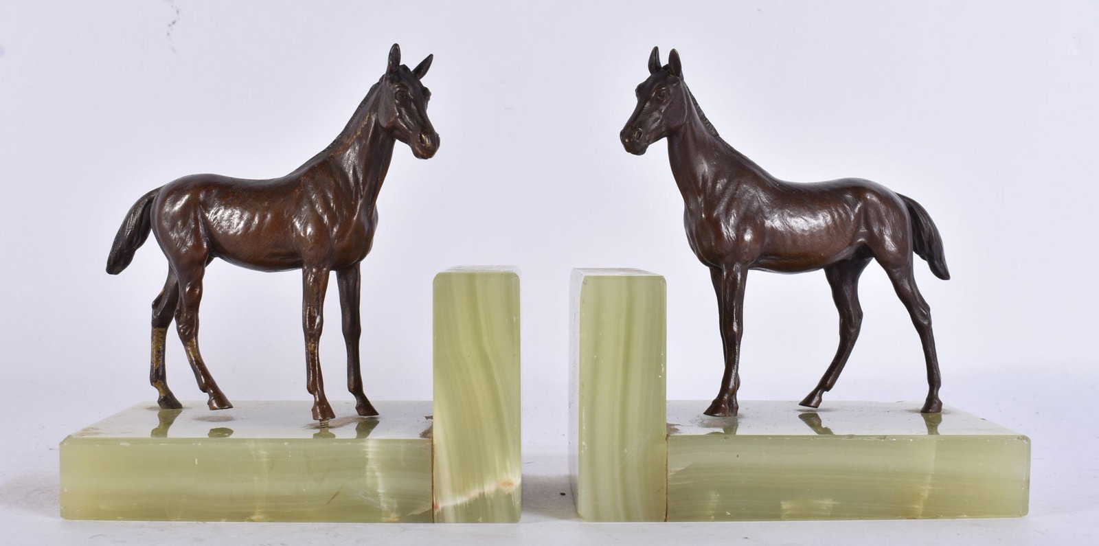 A PAIR OF 19TH CENTURY AUSTRIAN COLD PAINTED BRONZE AND ONYX HORSE BOOKENDS each cast as a standing (1 of 3)