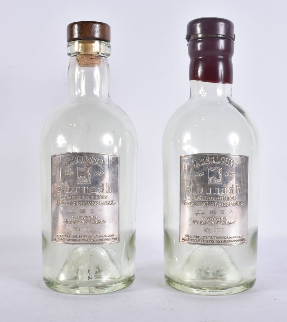 TWO ABERLOUR A'BUNADH GLASS WHISKY BOTTLES WITH STERLING SILVER PLAQUES each with a limited edition: TWO ABERLOUR A'BUNADH GLASS WHISKY BOTTLES WITH STERLING SILVER PLAQUES each with a limited edition sterling silver label to the front, one with red wax sealed cap and one with wooden stopper. 24 cm h