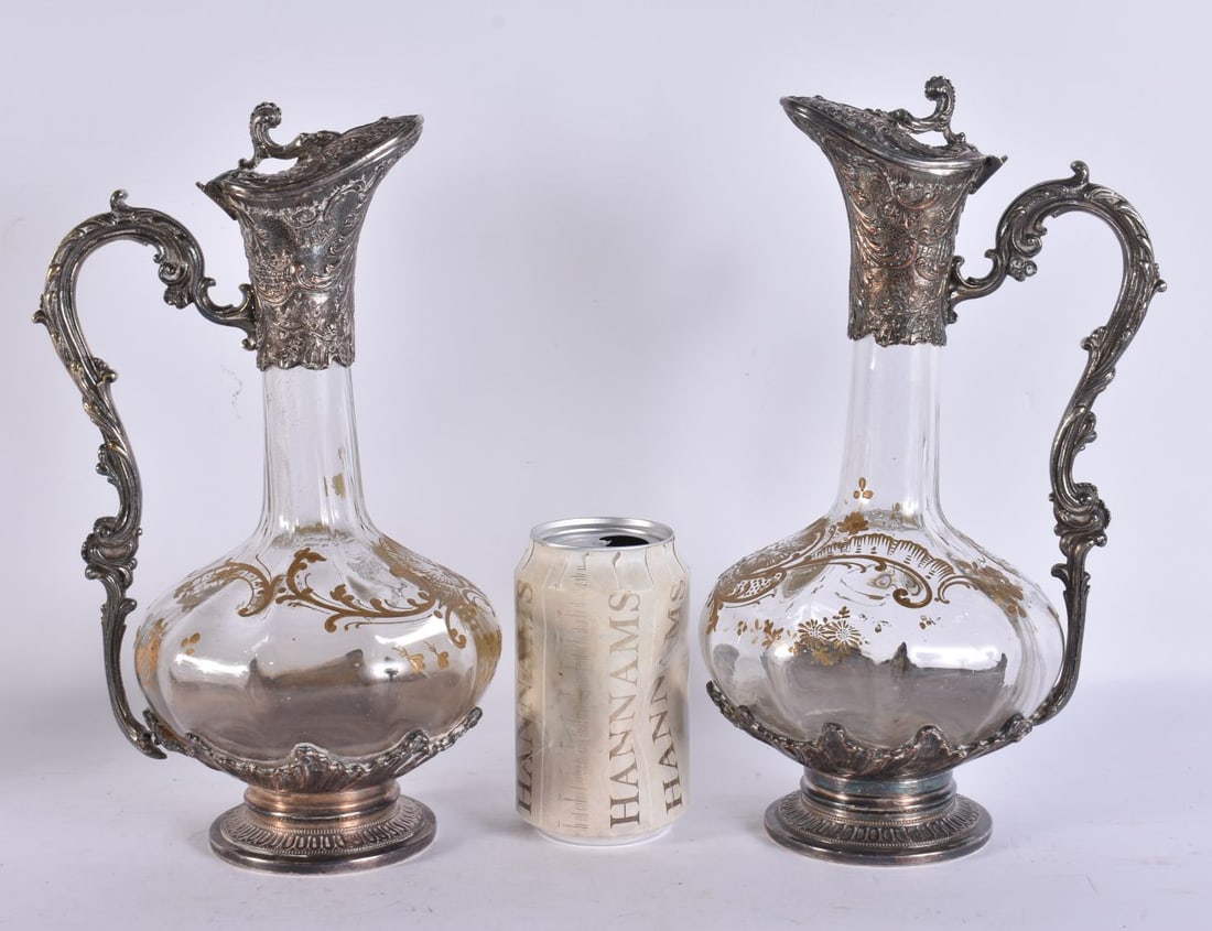 A PAIR OF VICTORIAN GILDED GLASS EWERS. 28 cm high. (1 of 4)