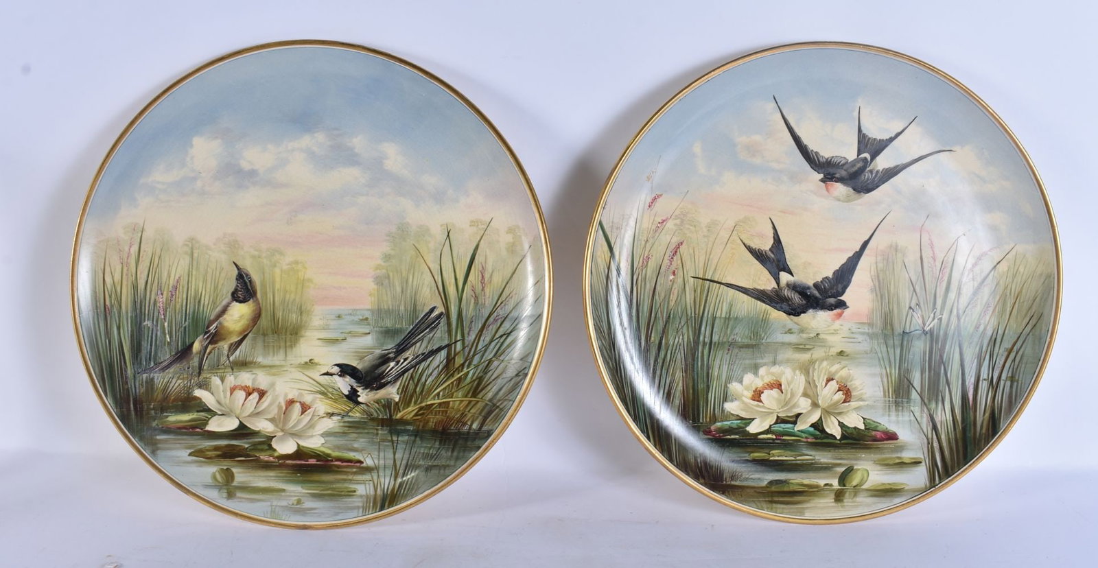 A PAIR OF ANTIQUE CONTINENTAL POTTERY DISHES. 37 cm wide.: A PAIR OF ANTIQUE CONTINENTAL POTTERY DISHES. 37 cm wide.