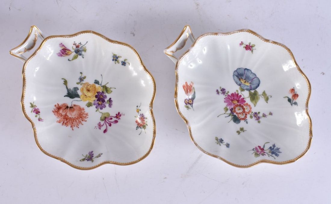 A PAIR OF ANTIQUE DANISH COPENHAGEN PORCELAIN LEAF SHAPED DISHES painted with flowers. 18 cm x 13 cm (1 of 4)