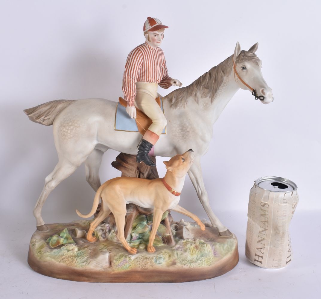 A VERY RARE VICTORIAN BISQUE PORCELAIN FIGURE OF JOCKEY ON HORSEBACK modelled with a roaming hound.: A VERY RARE VICTORIAN BISQUE PORCELAIN FIGURE OF JOCKEY ON HORSEBACK modelled with a roaming hound. 34 cm x 28 cm.