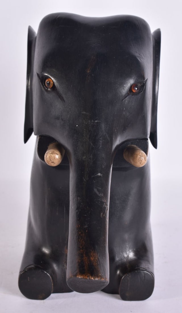 AN UNUSUAL 1930S CARVED WOOD NOVELTY ELEPHANT NUT CRACKER. 18 cm x 8 cm. (1 of 6)