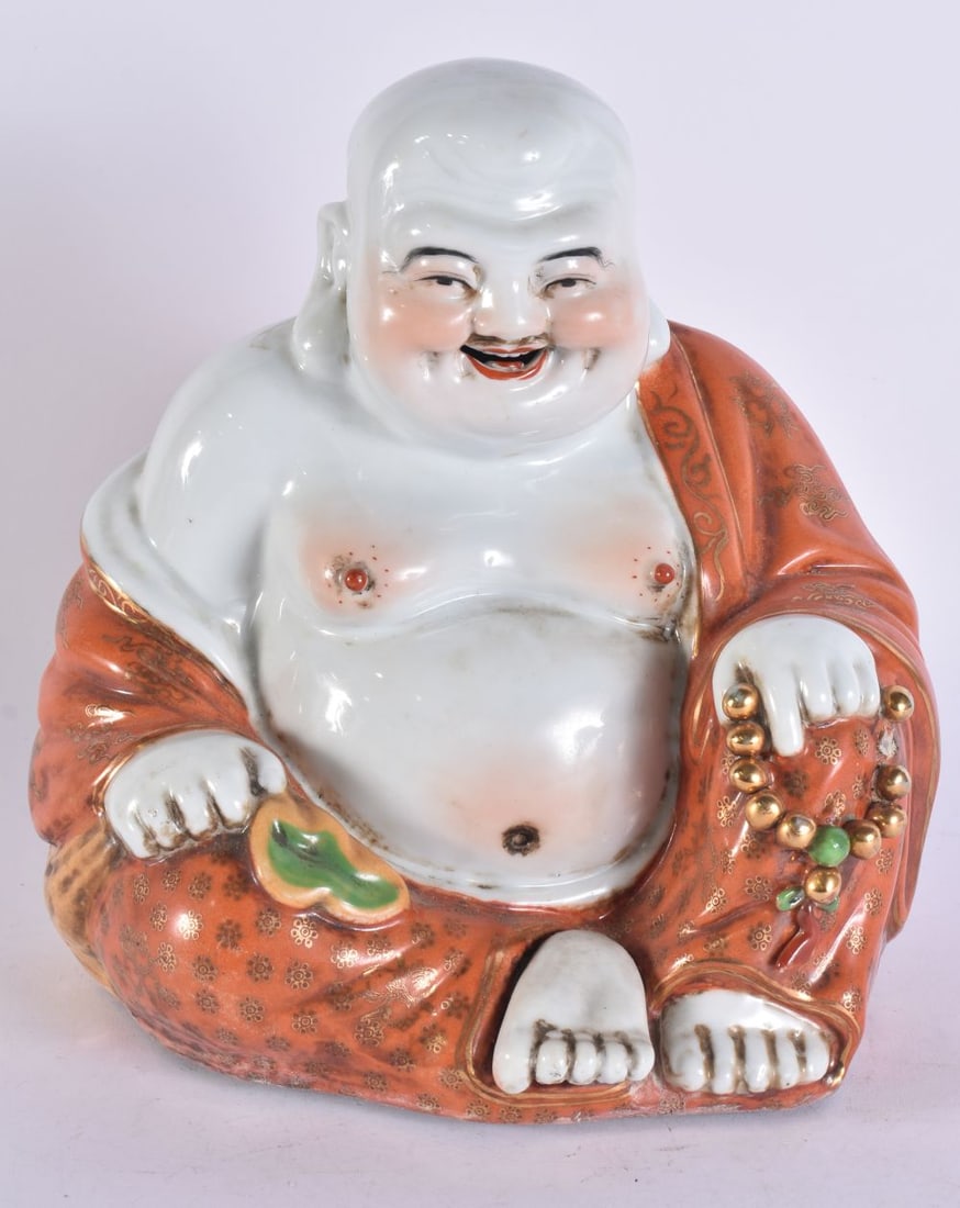 A CHINESE REPUBLICAN PERIOD CORAL GLAZED PORCELAIN FIGURE OF A BUDDHA. 24 cm. 16 cm.: A CHINESE REPUBLICAN PERIOD CORAL GLAZED PORCELAIN FIGURE OF A BUDDHA. 24 cm. 16 cm.